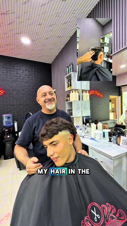 A mullet haircut, short at the sides and longer at the back