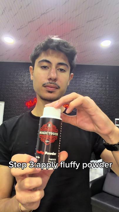 A Magic Touch Fluffy Powder bottle held up in the shop